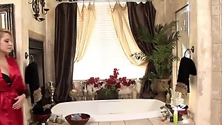Busty blonde masseuse gives head in bathtub